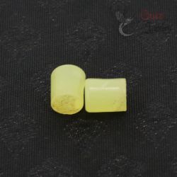TOP SIDE ANGLE-5: Pair of antique Burmese glass ear plugs in translucent yellow-green trade glass, top and side angle view