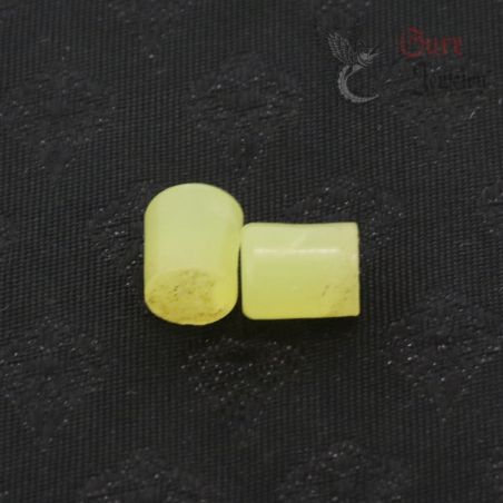 TOP SIDE ANGLE-5: Pair of antique Burmese glass ear plugs in translucent yellow-green trade glass, top and side angle view