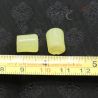 with ruler -1: Measurement view of traditional glass ear plugs from northern Myanmar with ruler indicating size