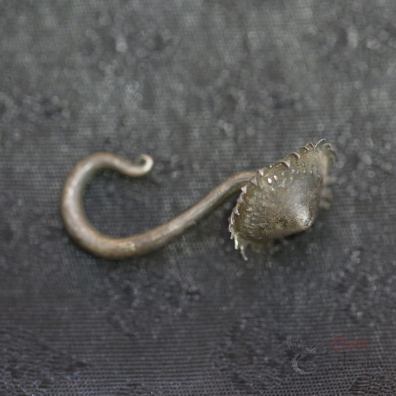 TOP SIDE ANGLE-2: Traditional long hook earring with flower terminal, top and side angle showing curved hook and aged patina