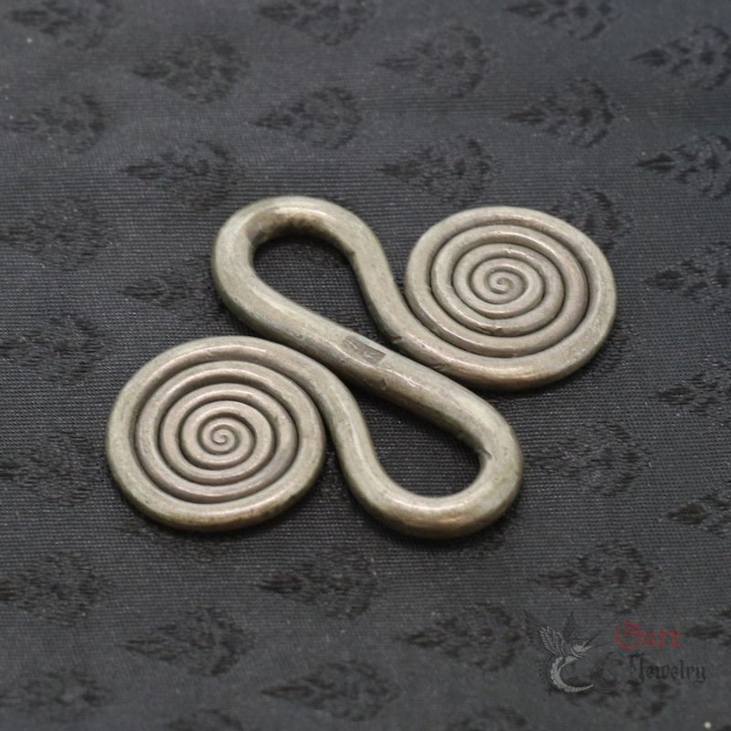 Miao Dong silver apron fastener top side angle view Guizhou