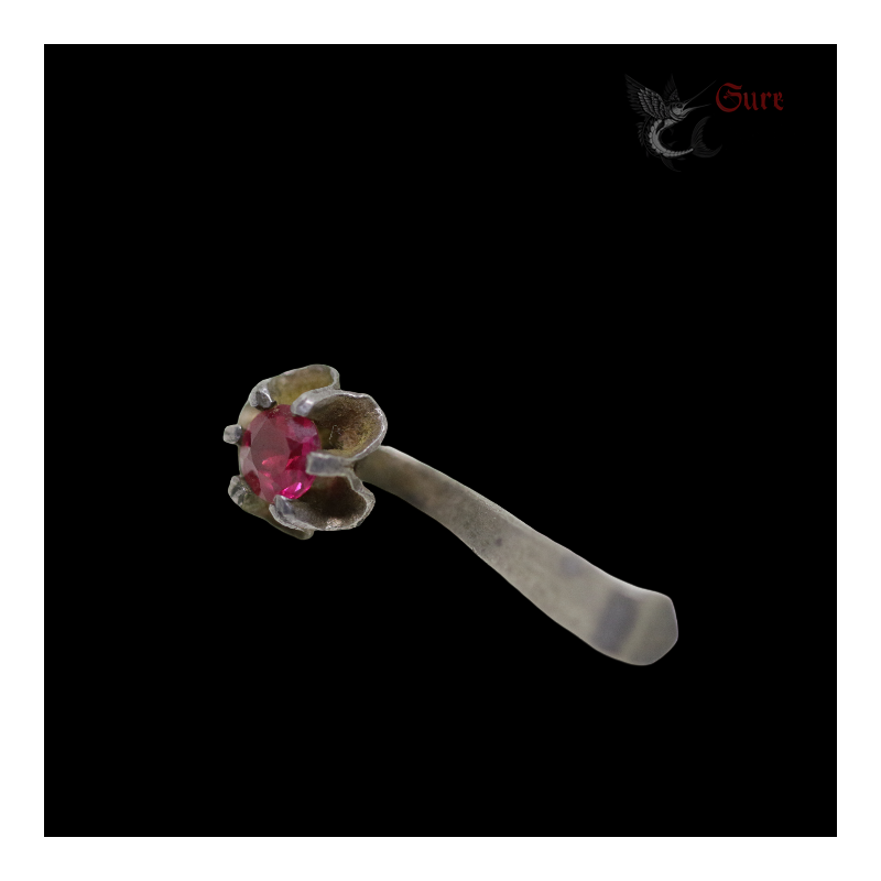 Antique northern Vietnamese silver earring with red stone, top side angle view 1