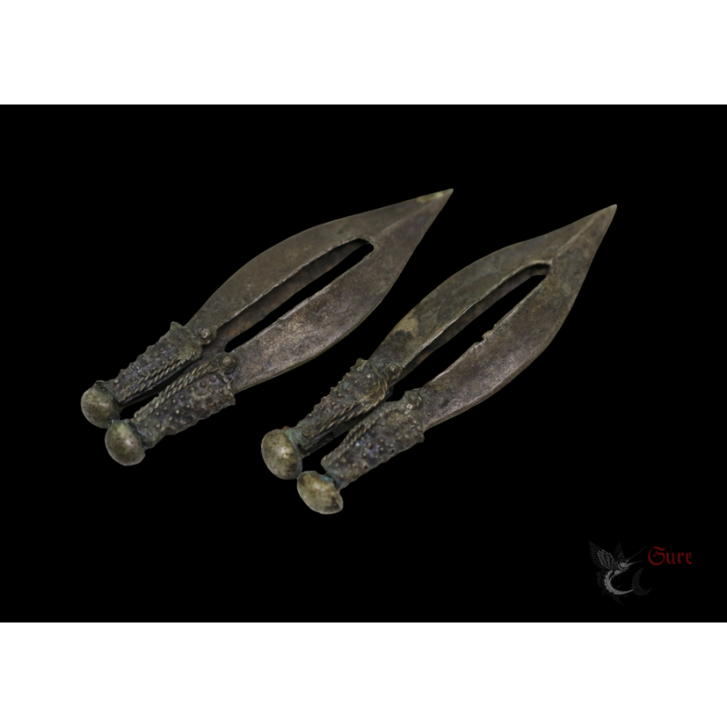 Lembata brass earrings pair elongated tribal design top side angle