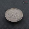 Antique Shan Akha tribal silver ear plug top side angle with repoussé floral design from Golden Triangle region