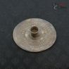 Large ethnic high silver ear ornament with repoussé decoration viewed from top side angle