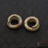 Ta Oy copper alloy spiral ear ornaments pair side angle close-up