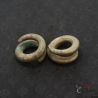 Ta Oy tribal copper alloy ear weights pair top angle view with aged patina