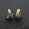 Copper alloy tribal ear ornaments pair detailed top side angle view