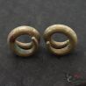 Authentic Ta Oy ear weights pair showing traditional spiral form