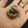 Ta Oy copper alloy ear ornaments in hand showing angles